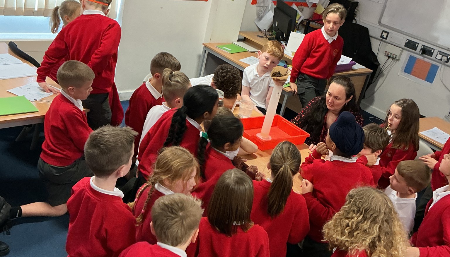 Waiting to see the volume of water that filters through the soil.