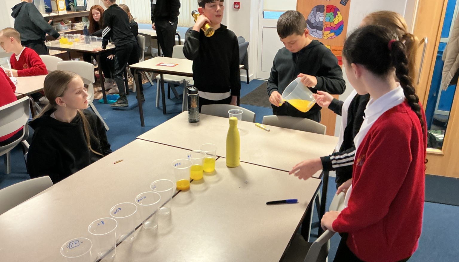 Using a ratio of orange juice to water.