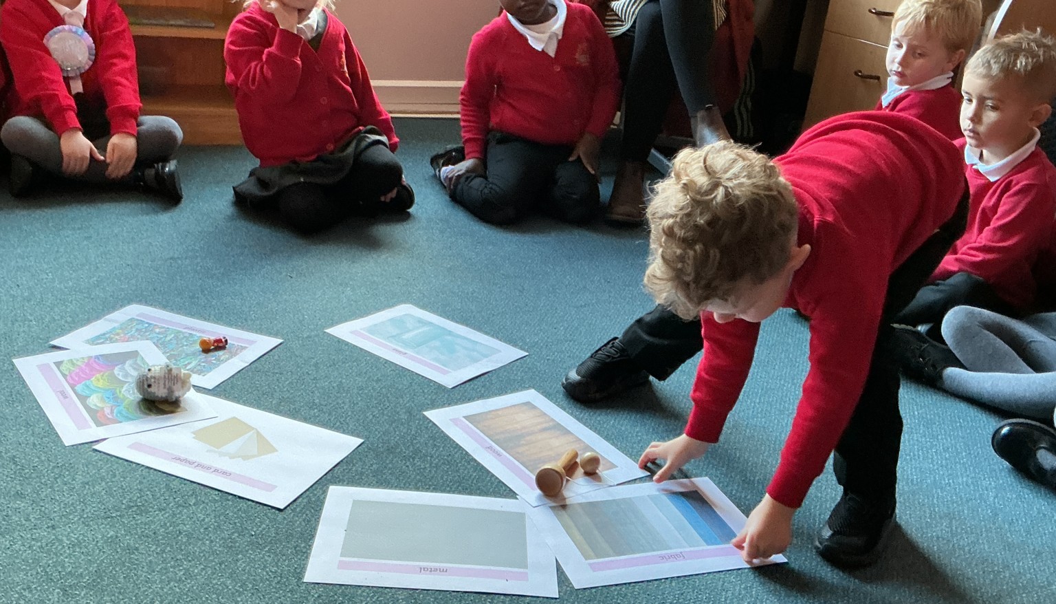 Sorting toys by their materials.