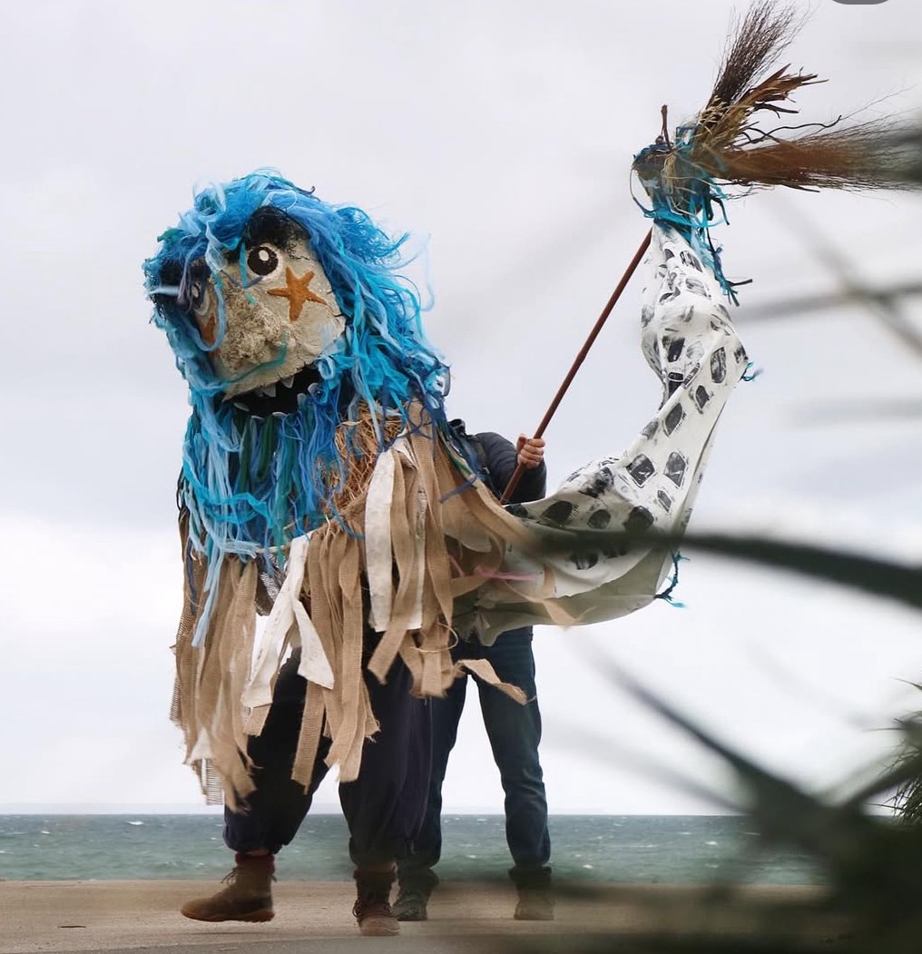 With his dancing tail