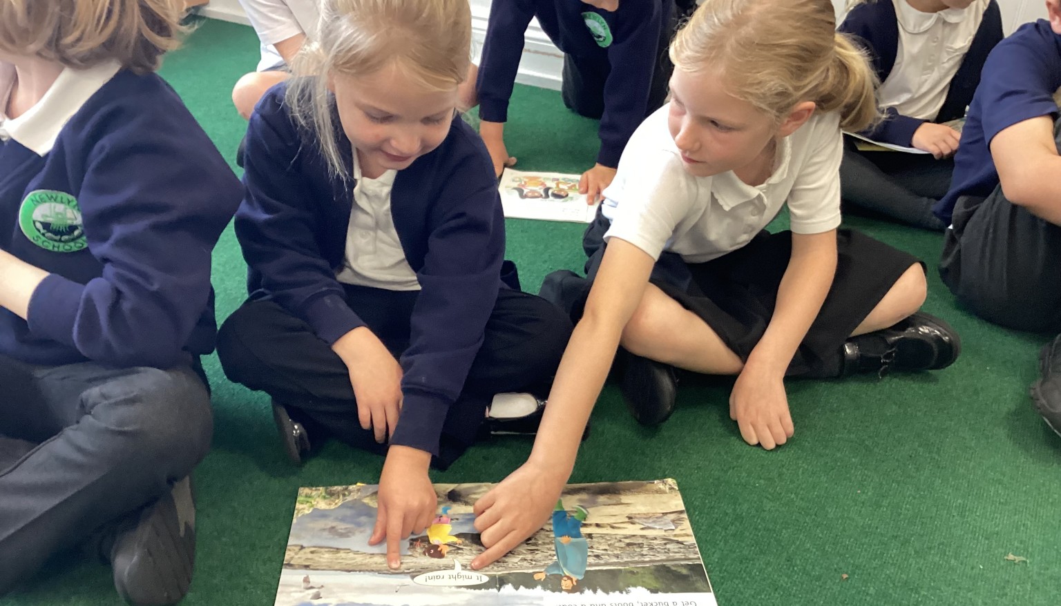 Year 1 & Year 3 children reading together