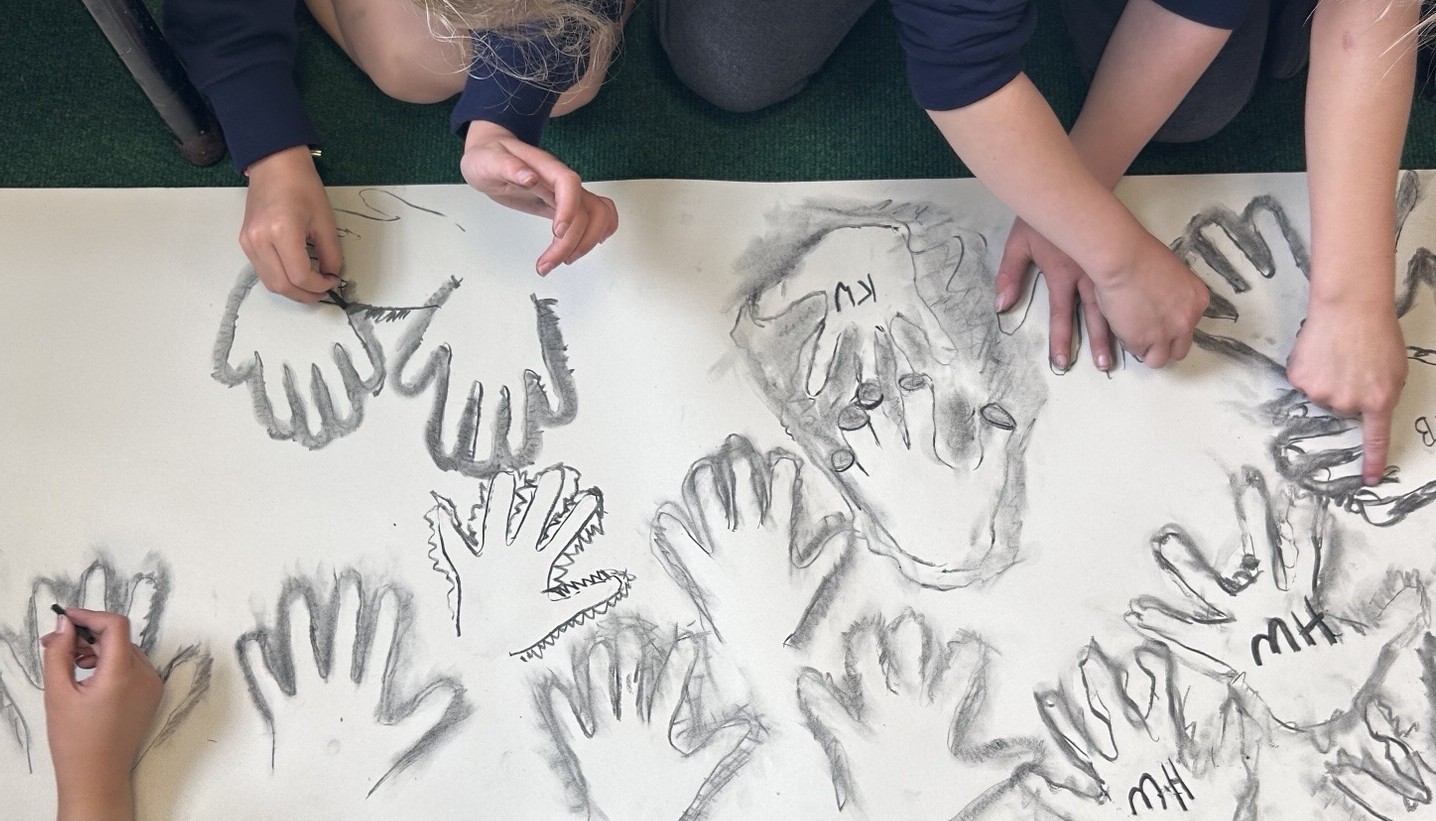 Art lesson, recreating pre-historic cave paintings. 