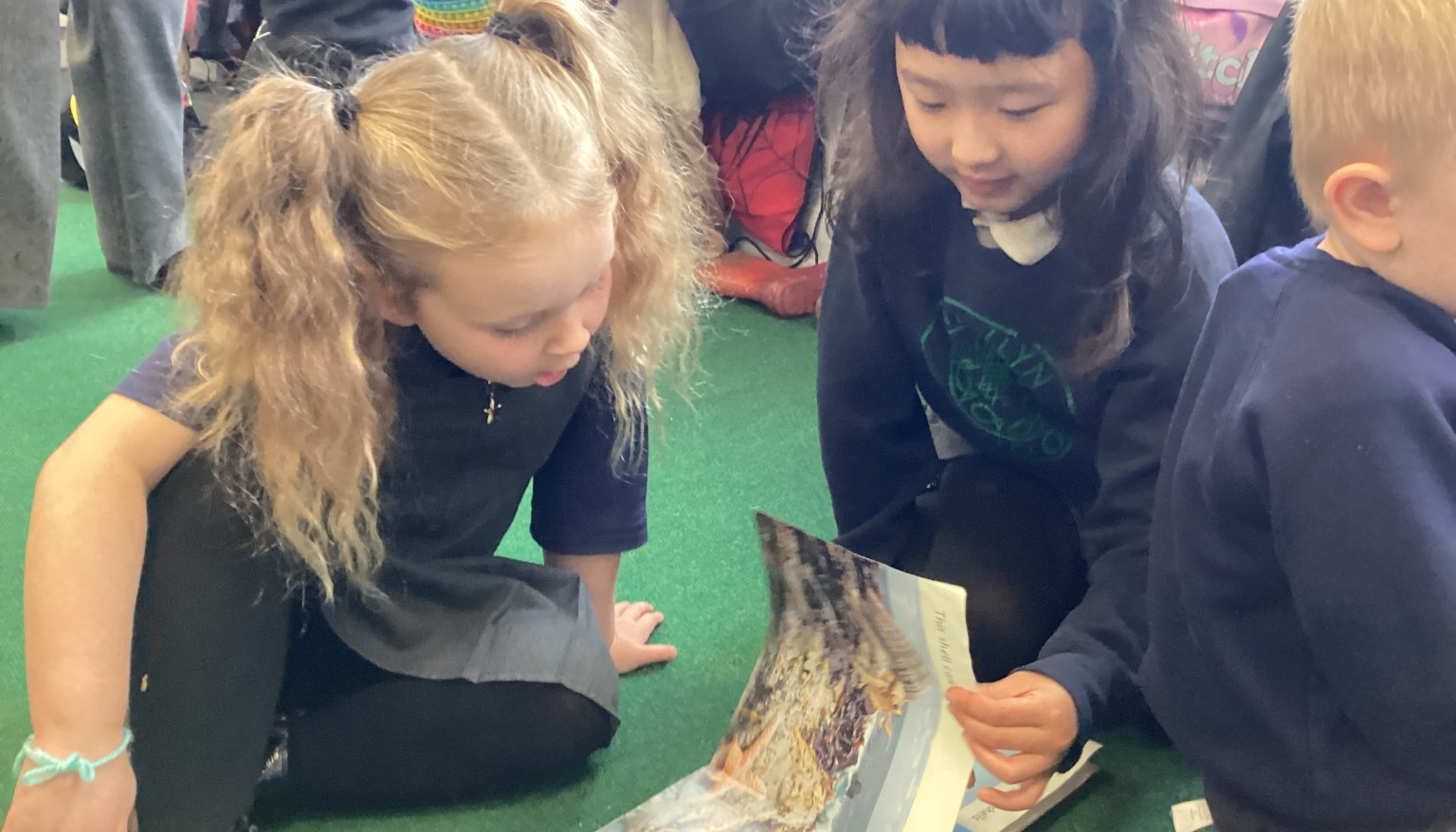 Year 1 & Year 3 children reading together