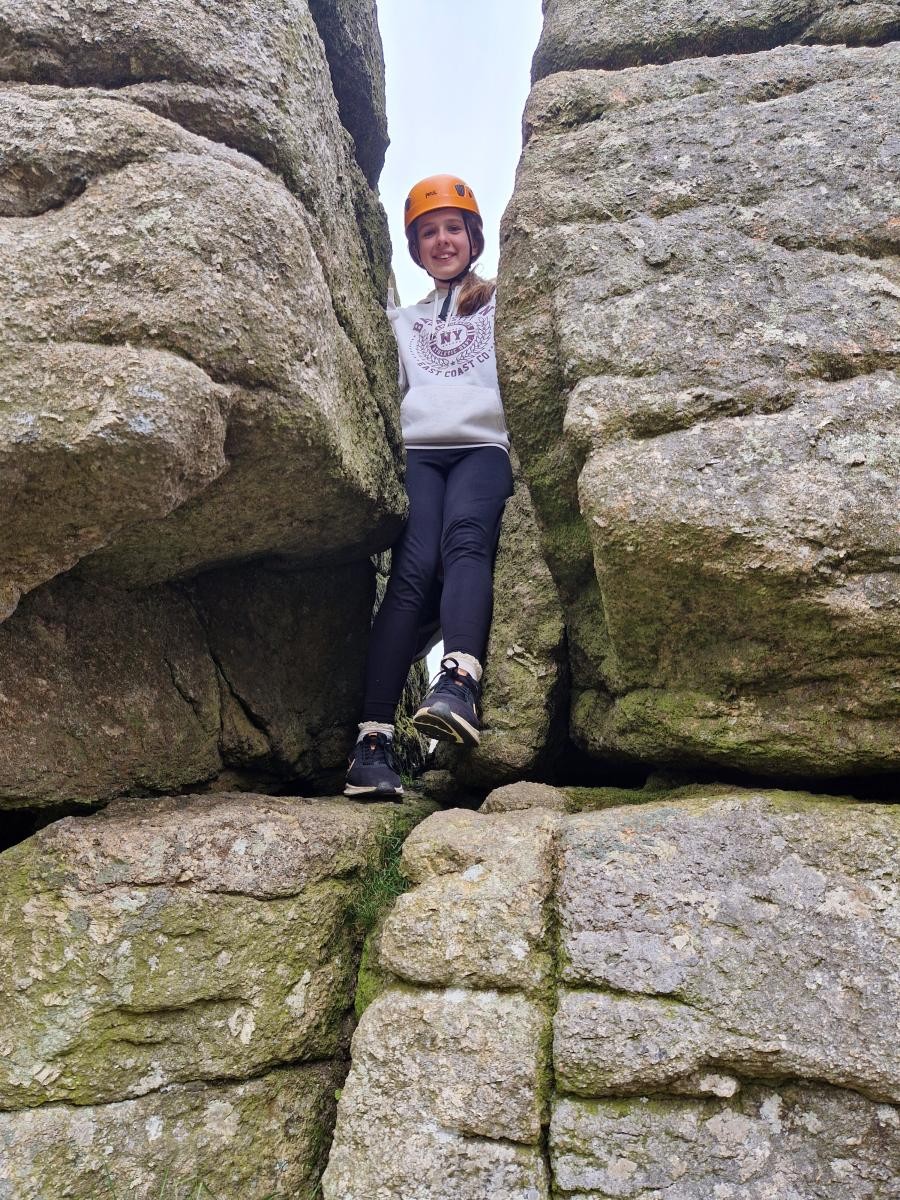 Child climbing rocks