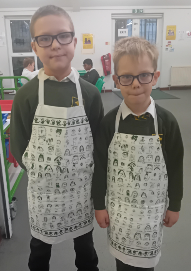 Breakfast club children are enjoying the aprons.