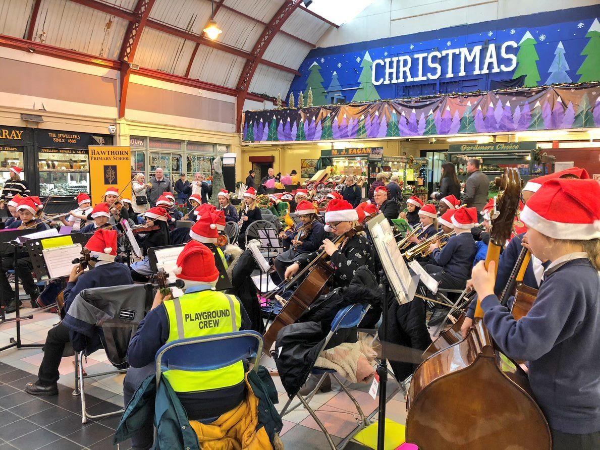 Hawthorn Primary Symphony Orchestra performing at Grainger Market.