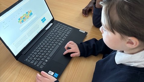 Using the laptops to find information.