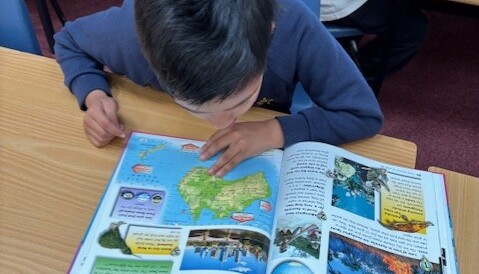 Locating countries in atlases.