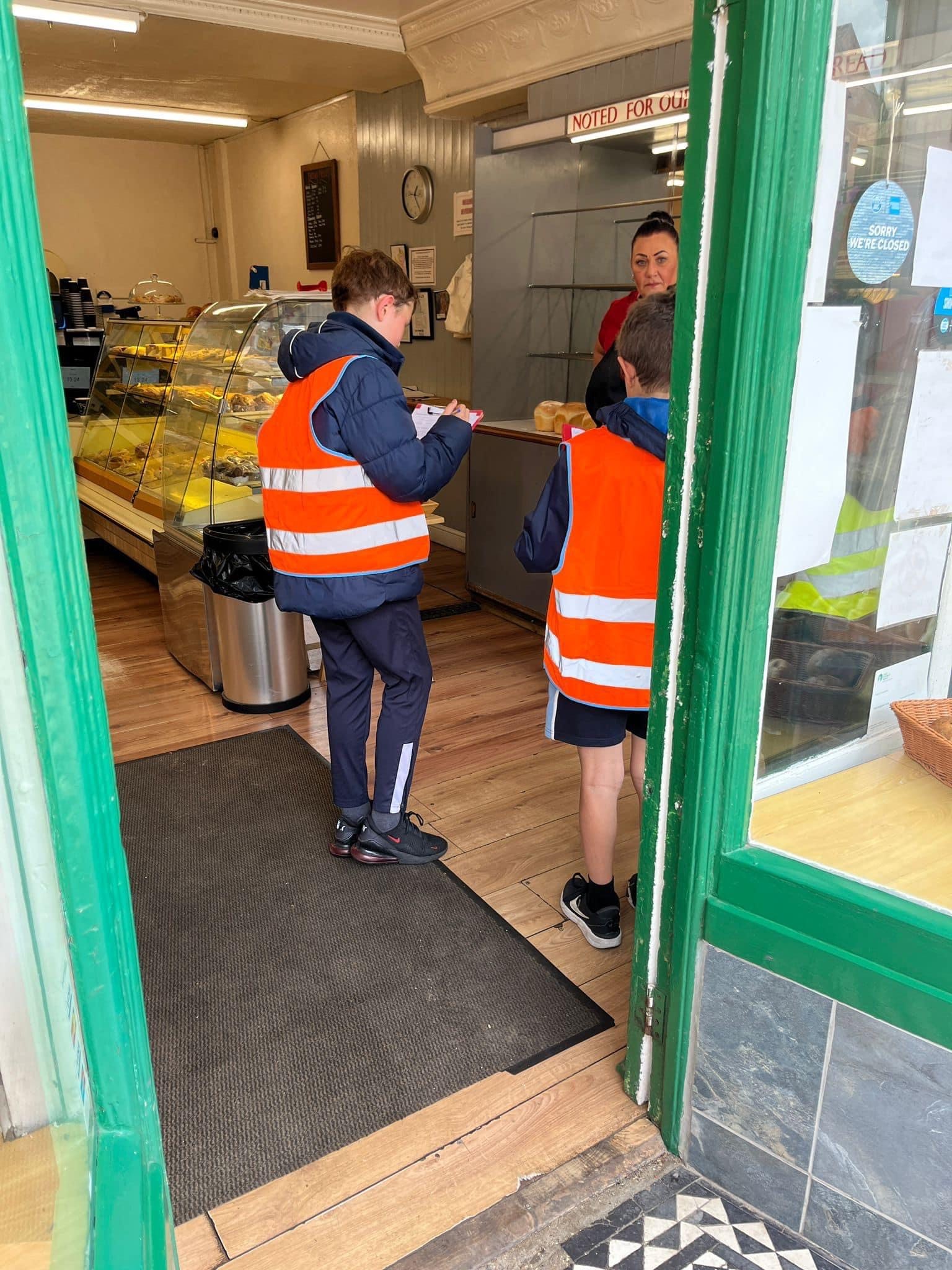 Children visiting the shops in the village