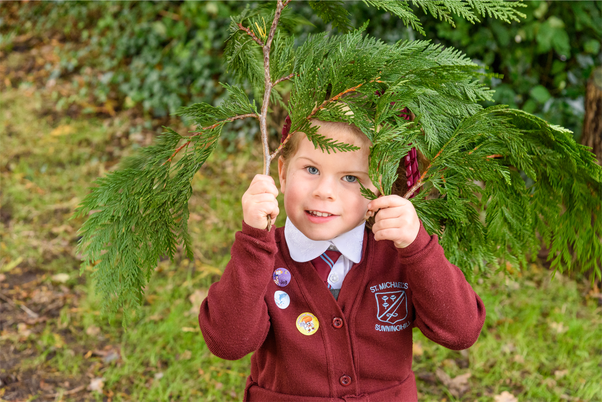 Child holding leaves