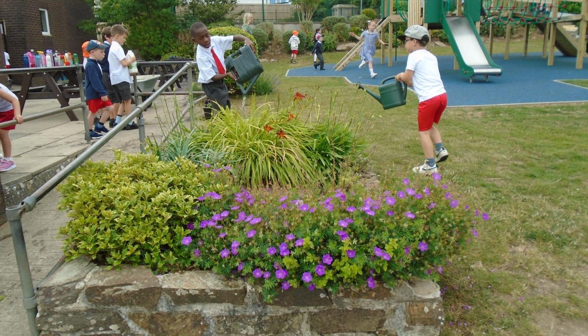 Children watering flowers