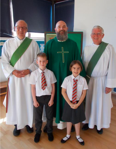 Our parish priest and deacons join us for Mass