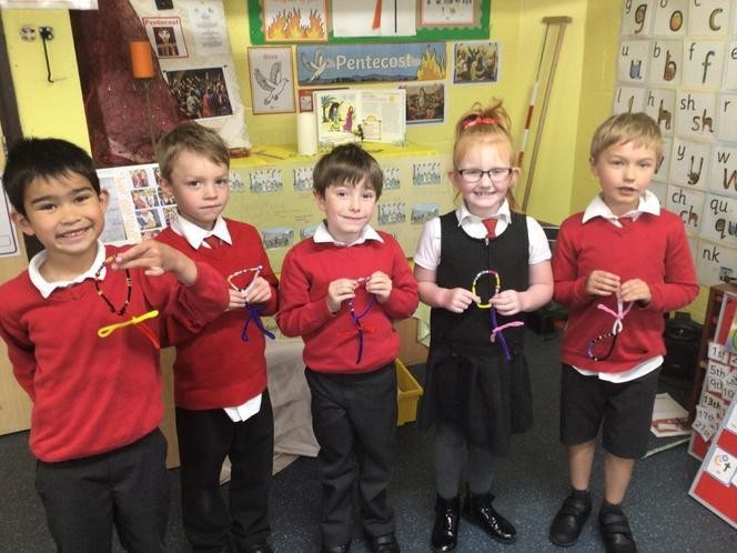 Children made their own rosaries to use in class prayer