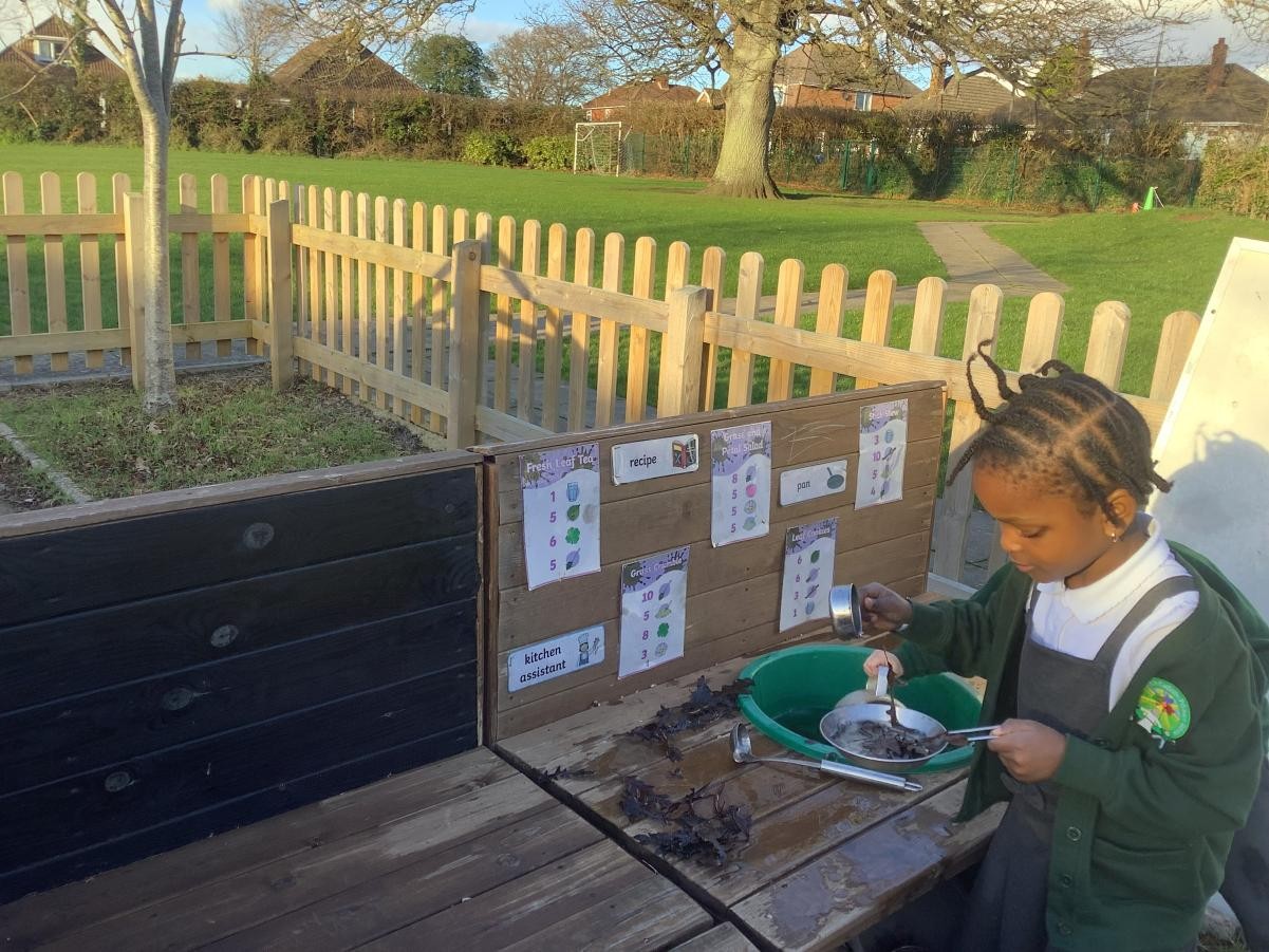 "Making tea" in our Reception and Nursery Outdoor Kitchen