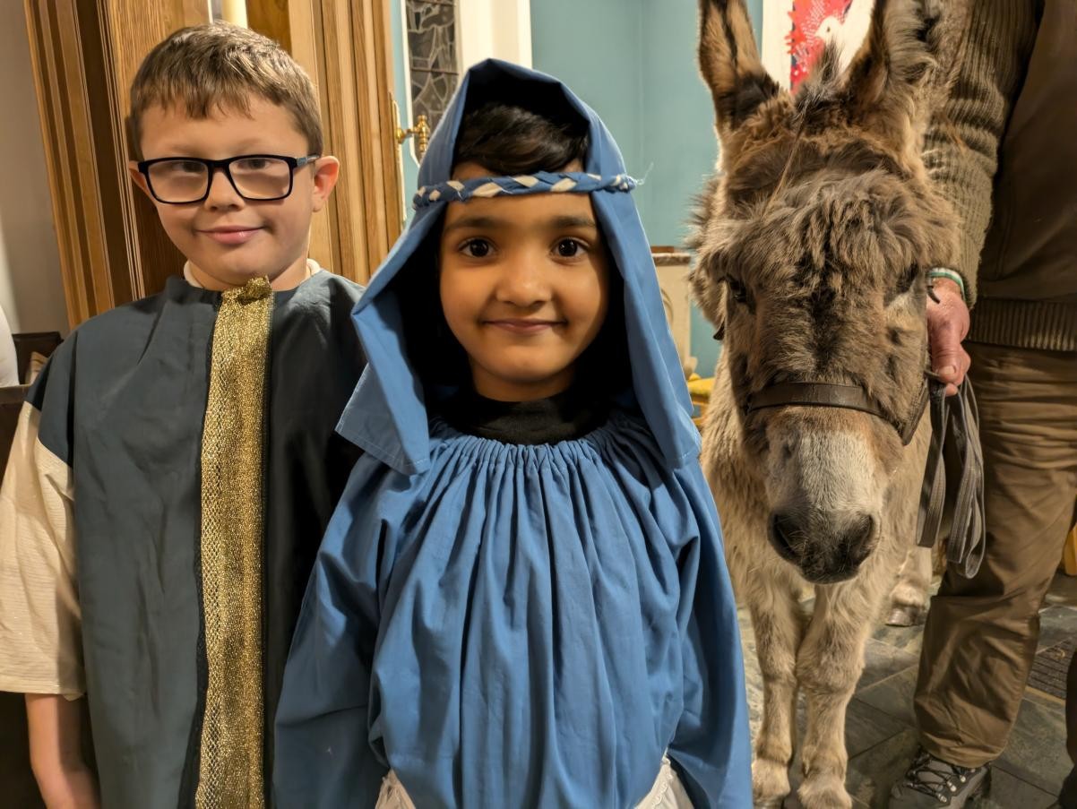 Joseph, Mary and Isachaar the Donkey at our Advent and Nativity service in The Holy Ghost Catholic Church.