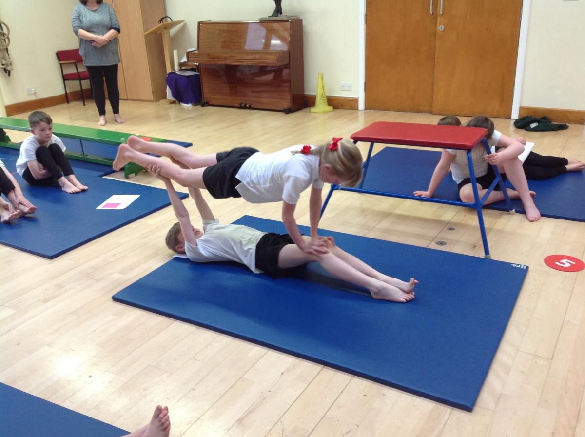 Now move the hands further towards the feet