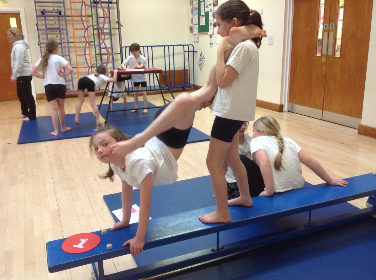 Partner balance on a bench.