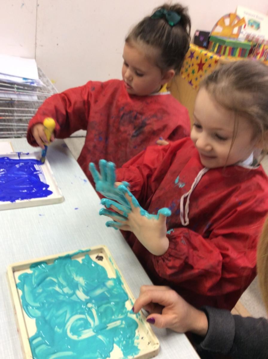 Mark making exploring paint.