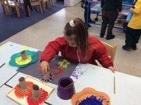 Using paint to make firework patterns.