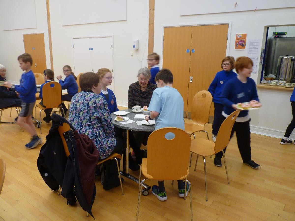 Our Parishioners being served tea and cake by our Mini Vinnies. November 2024.