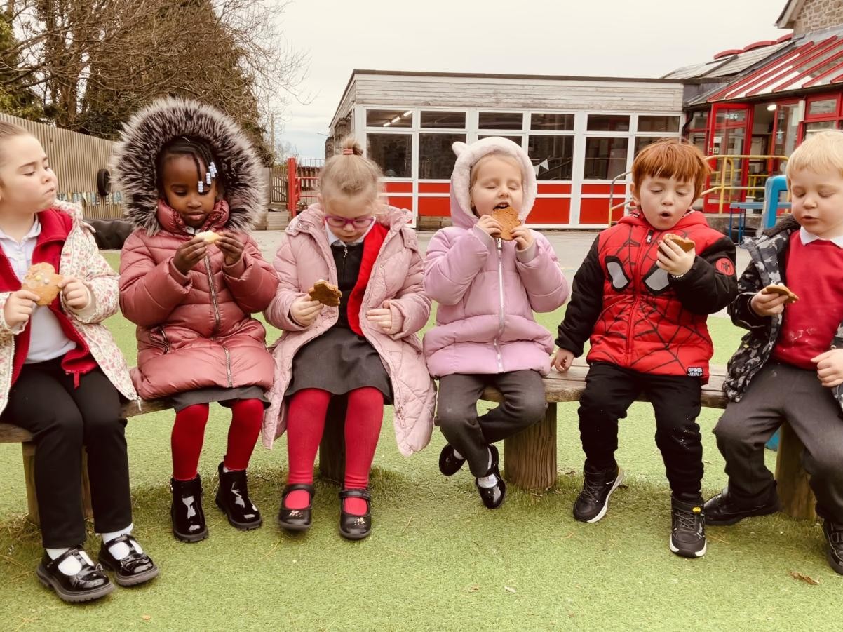 YUM! Eating our Gingerbread Men cookies