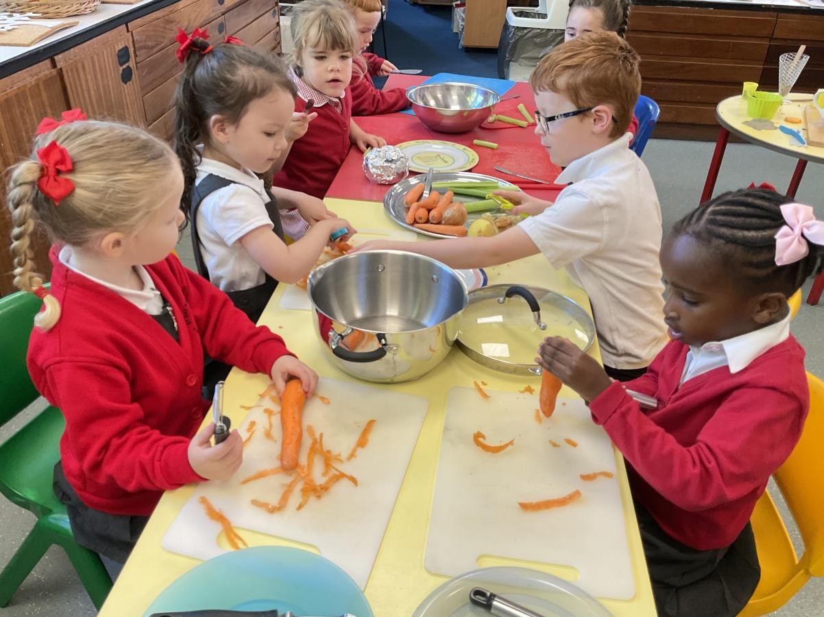 Peeling, cutting, smelling and measuring the vegetables for ou Harvest soup celebration!