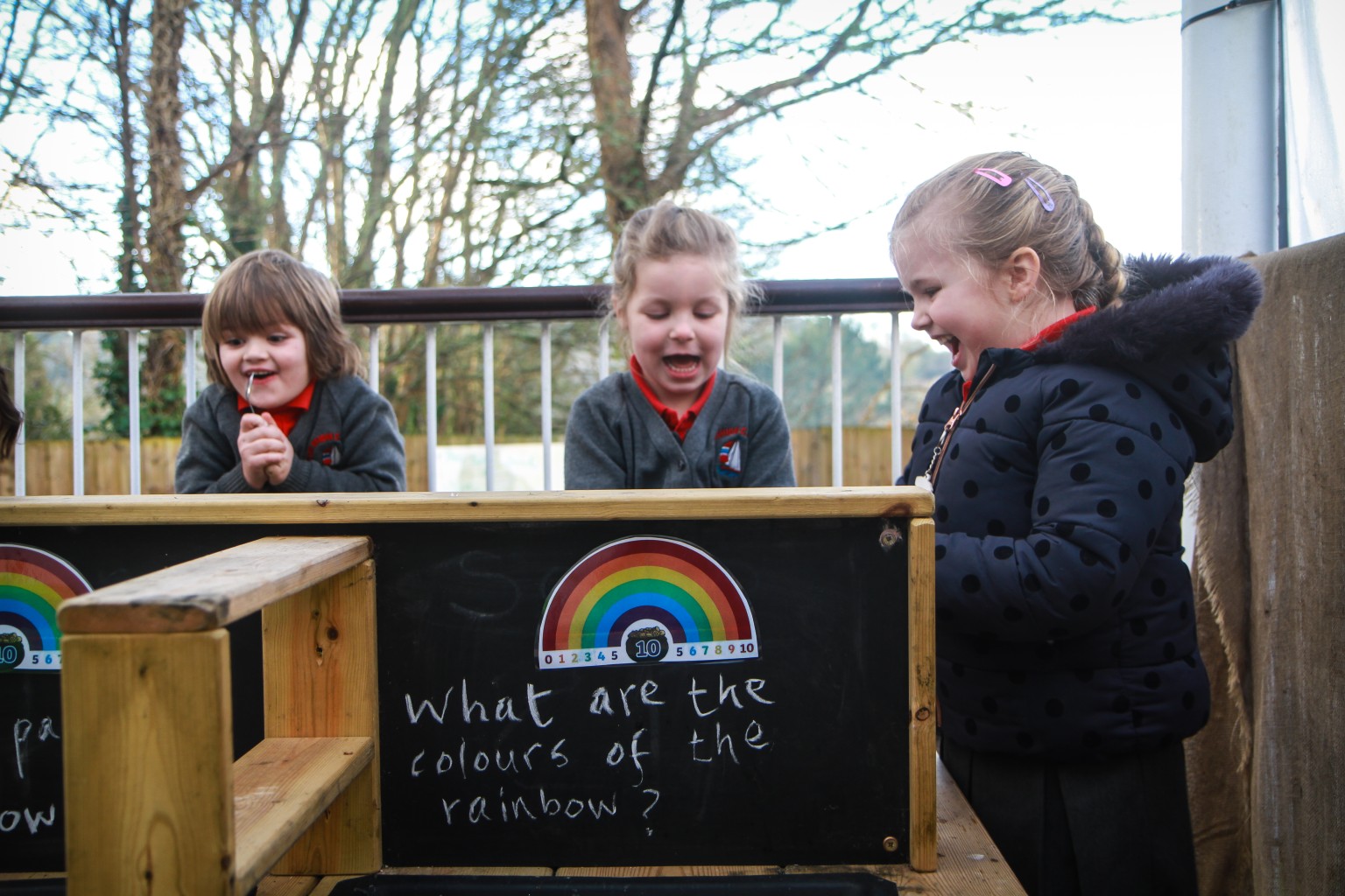 Three children playing outside