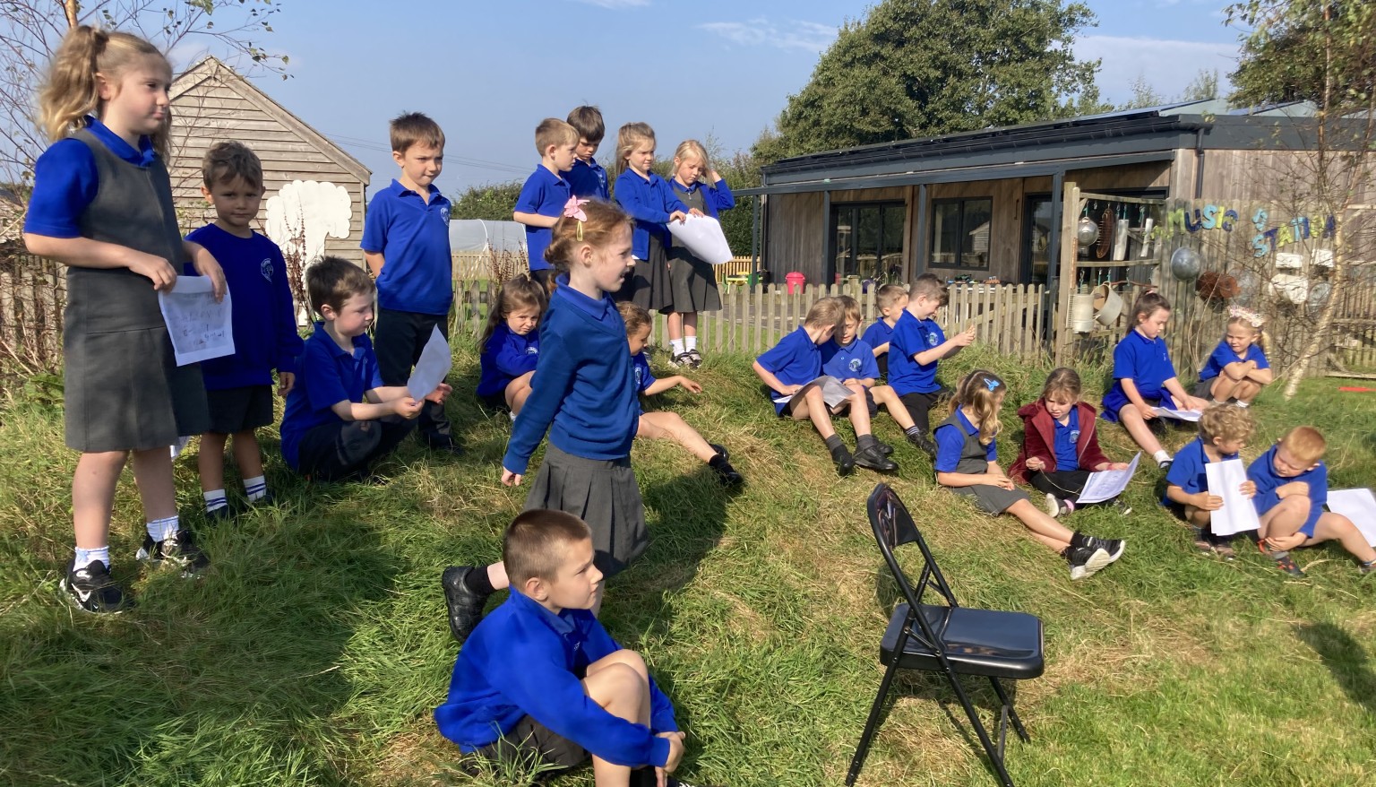 Watching rehearsals at the school's amphithatre