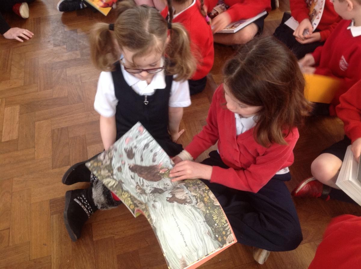 Sharing favourite books in whole school assembly