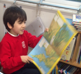 Using maps and atlases to locate the 7 continents and 5 oceans of the world in Year 2