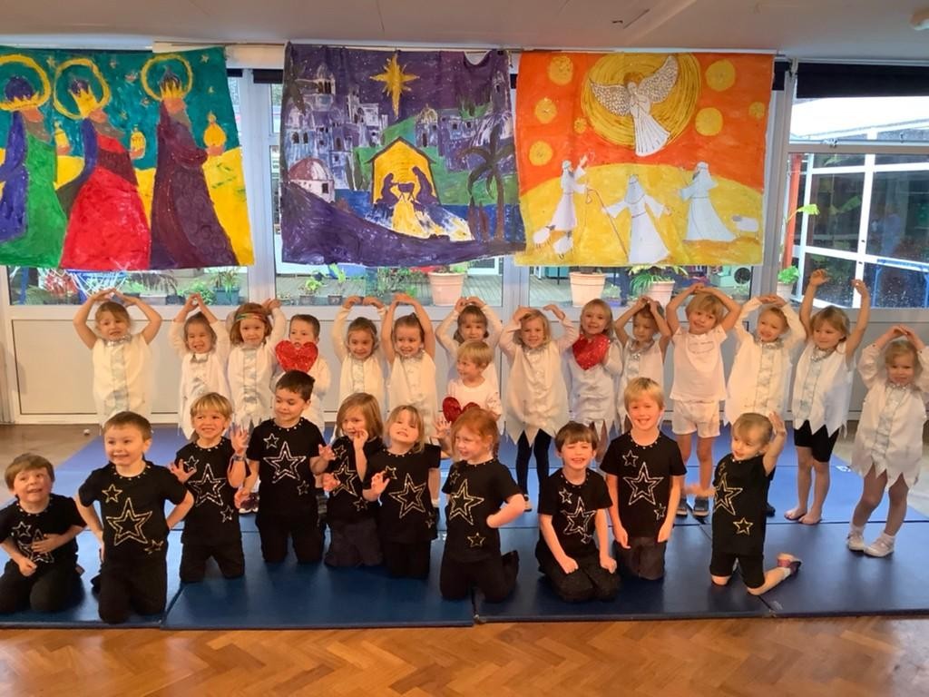 Childrn stood on a stage for play