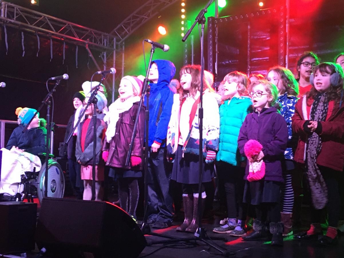 Children on stage singing