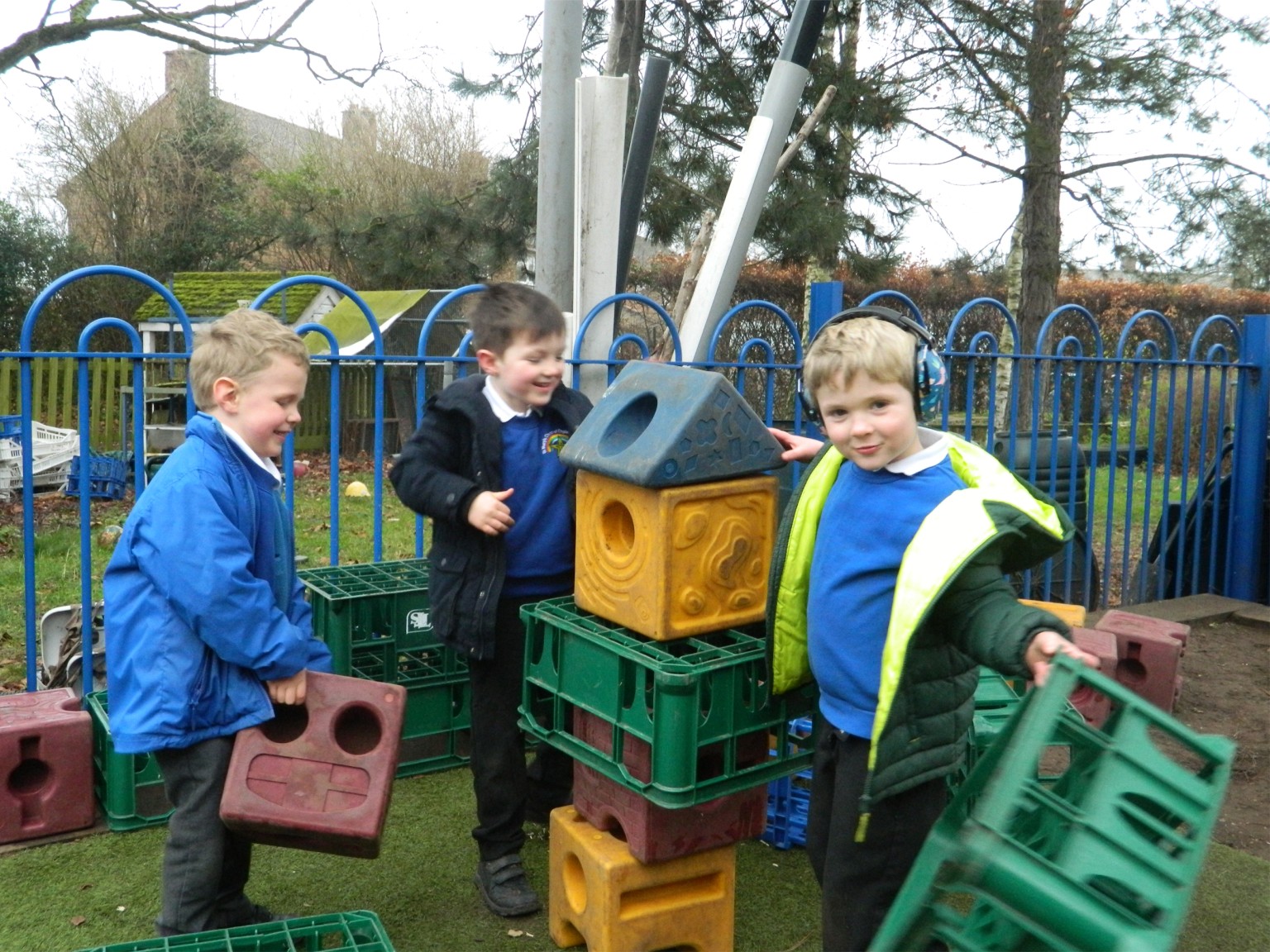 children building with plastic crates