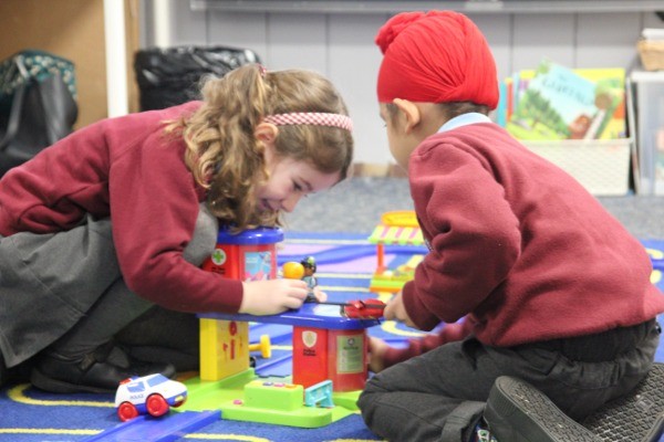 Two children playing in the classroom