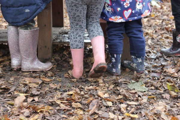 Feet in wellies in leaves