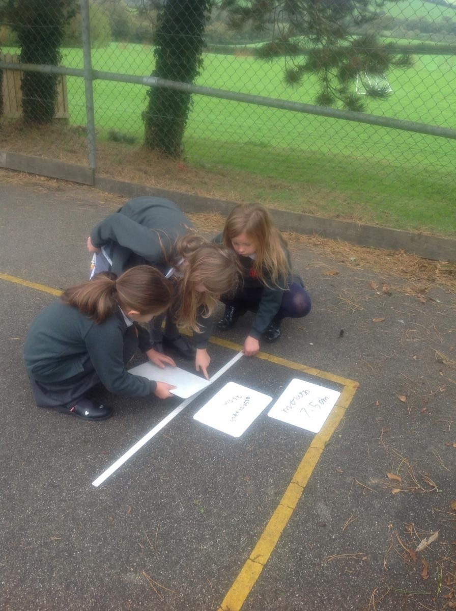 Year 4 during their ‘Animals including Humans’ unit of work, measuring out the length of the human digestive system.
