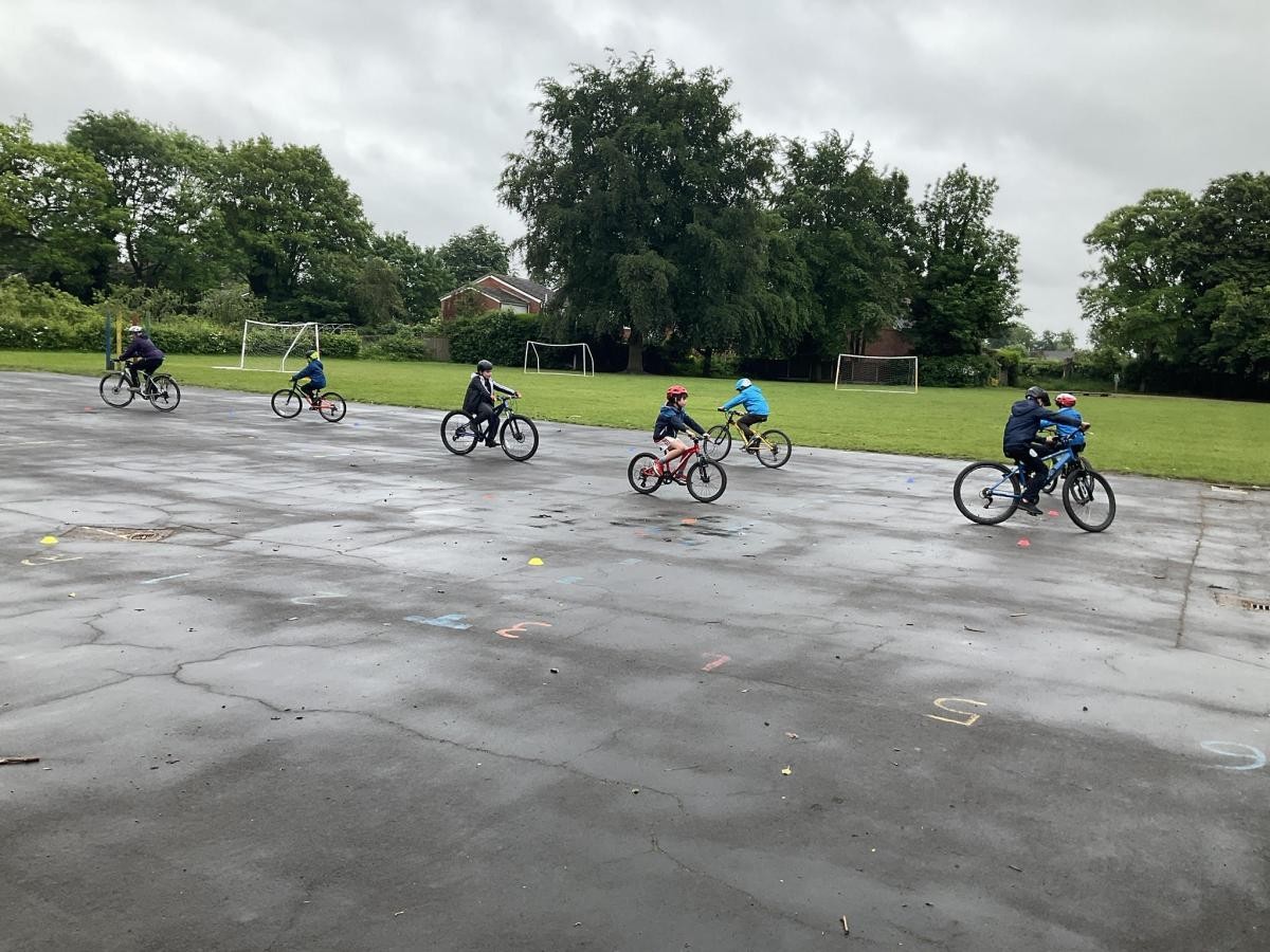 children riding bikes on the playground