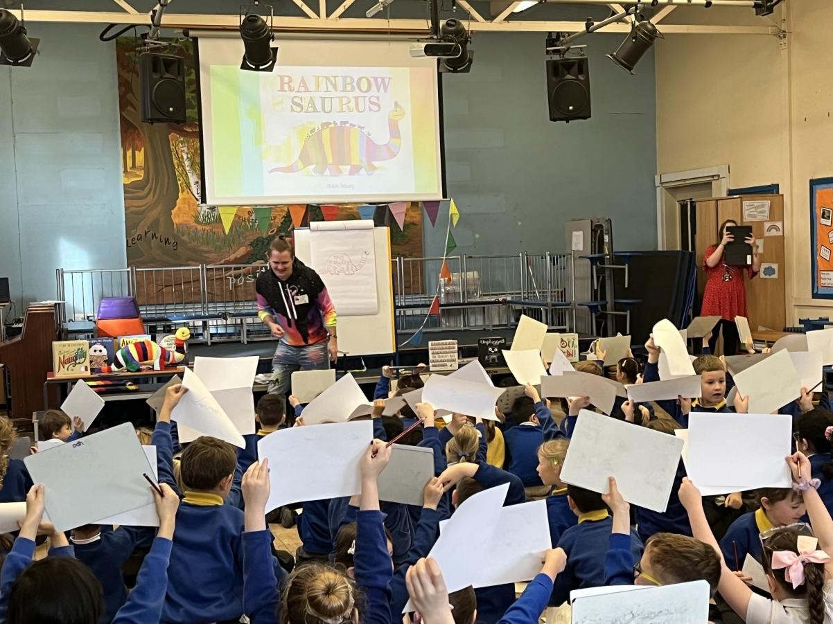 children holding up pieces of paper