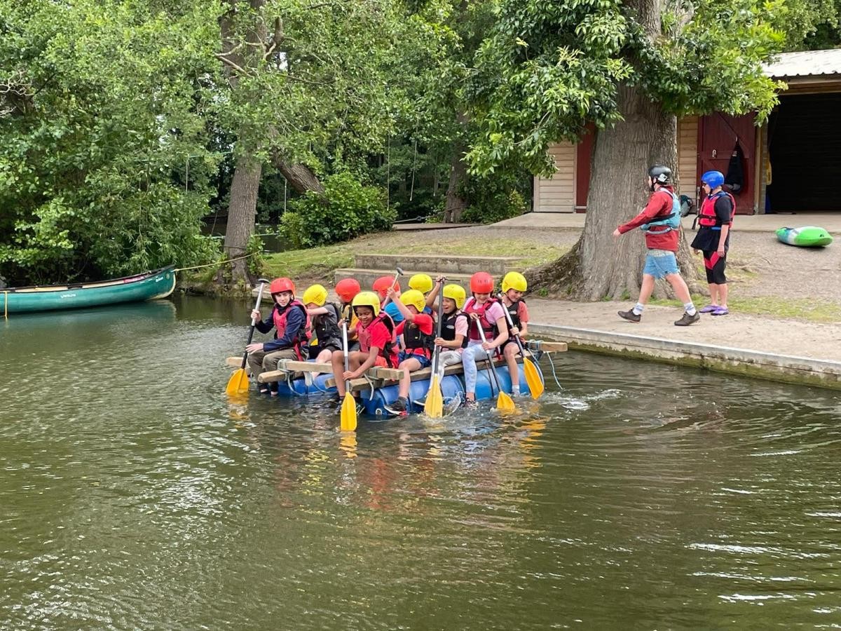 children on a raft 