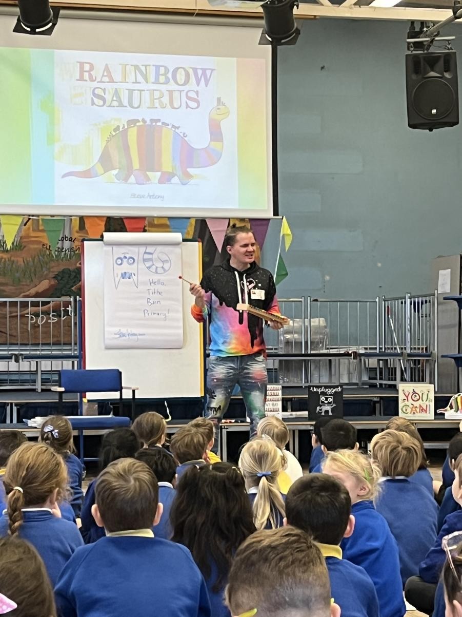 Adult pointing at a flip chart