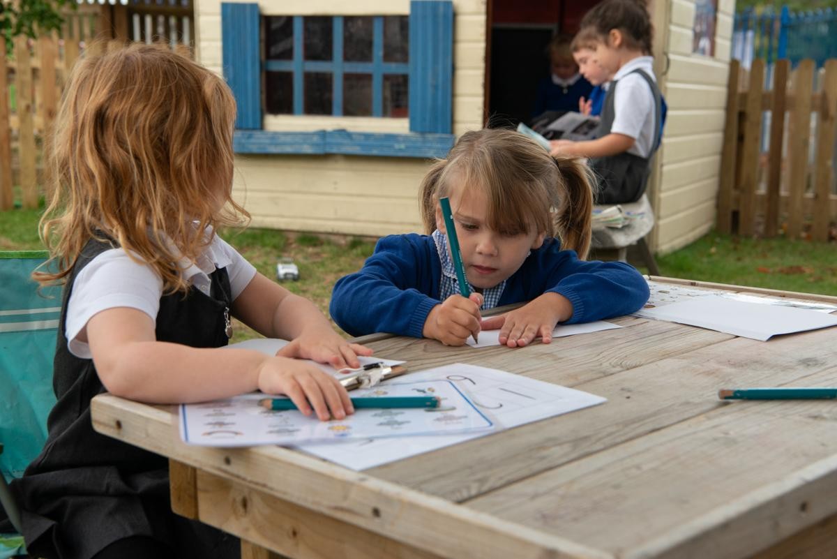 Children drawing outdoors