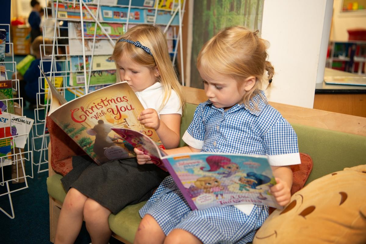 Two children reading books