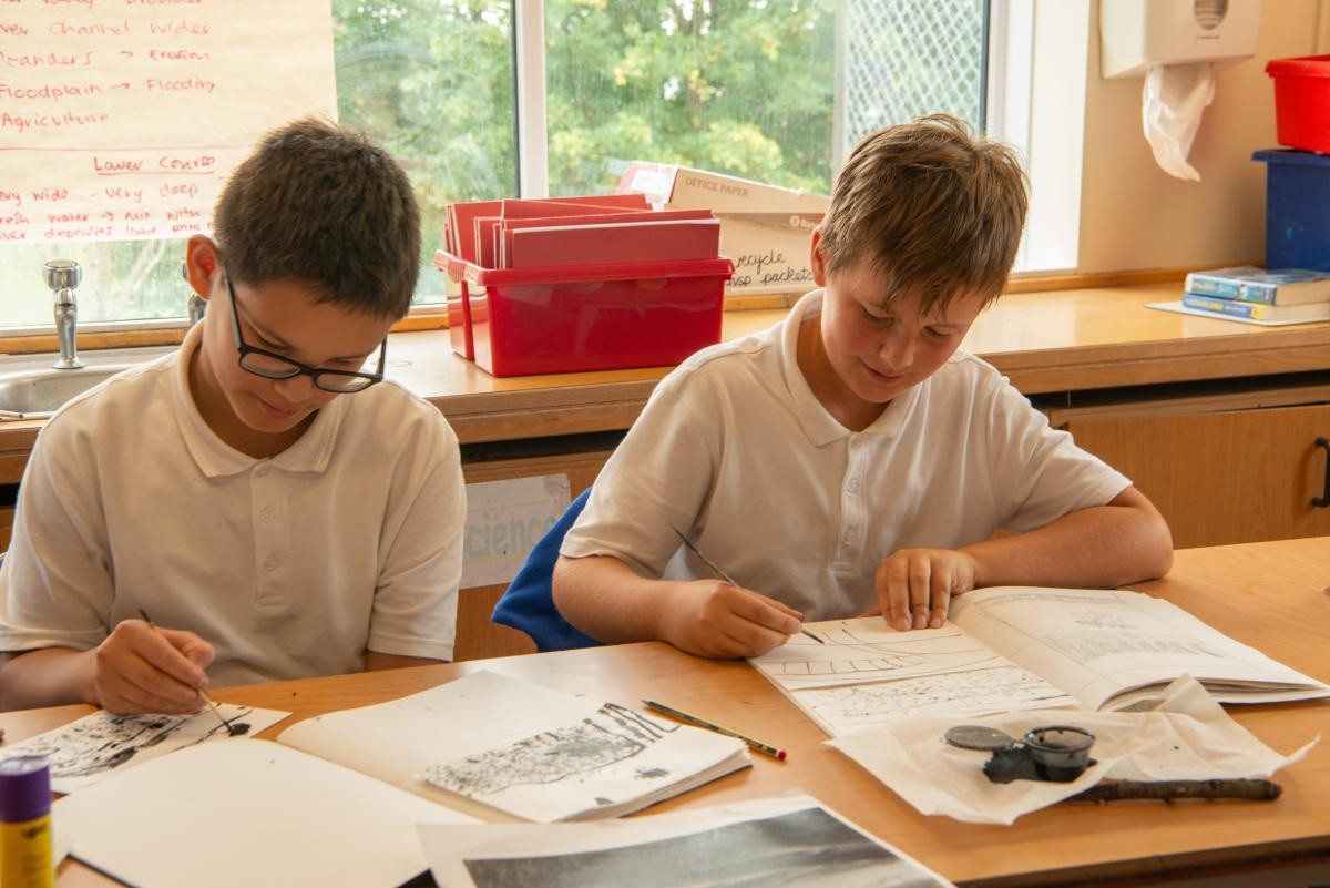 Two children reading books