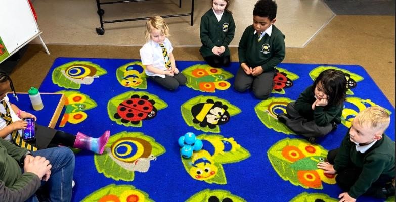 Our EYFS children experiment with controlling a robot.