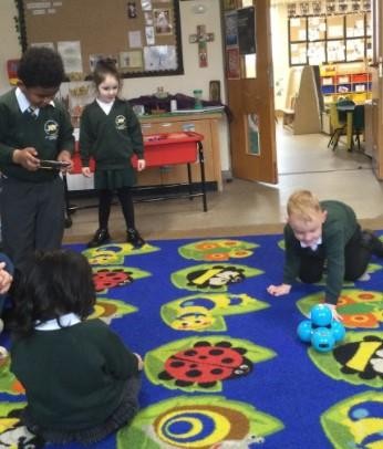 Our EYFS children experiment with controlling a robot.