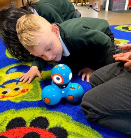 Our EYFS children experiment with controlling a robot.