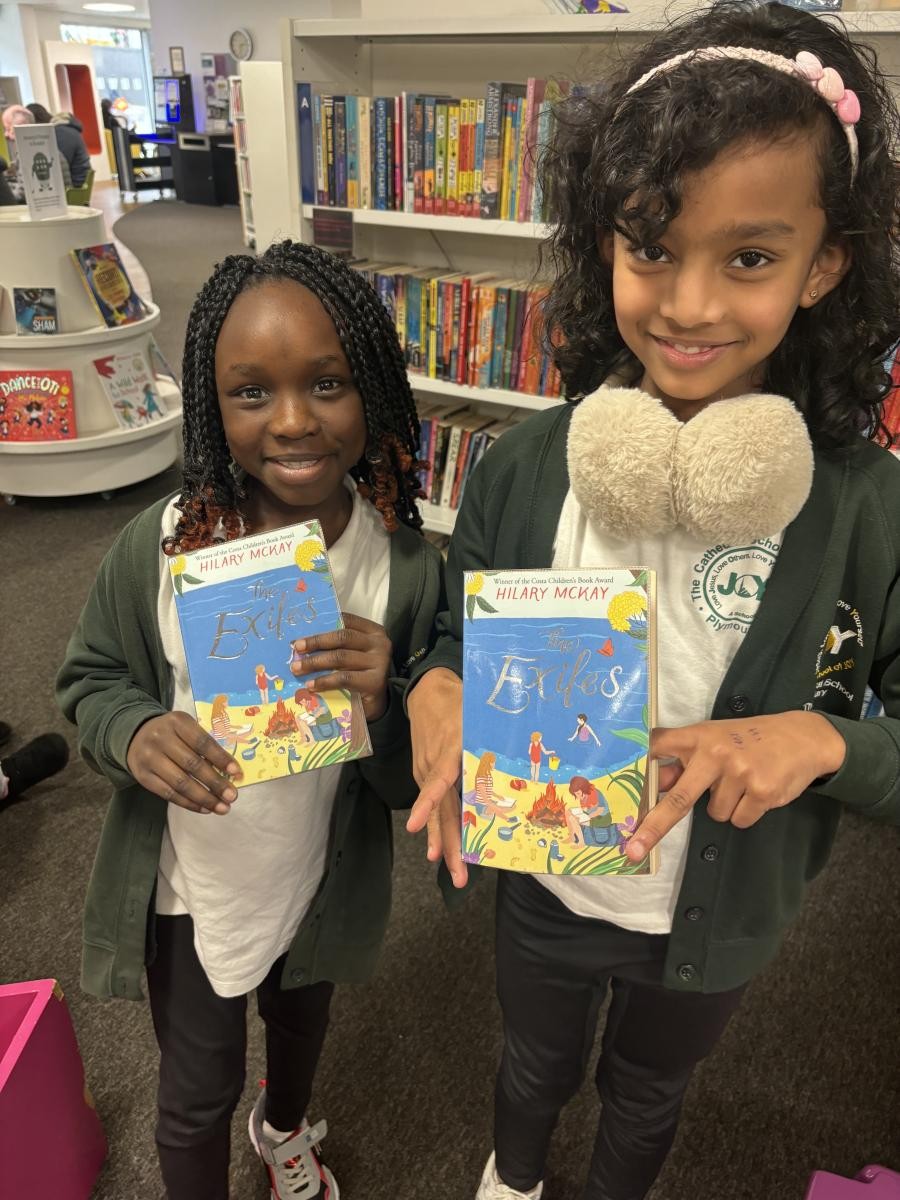 Happy finding the same book as a friend during our library visit!