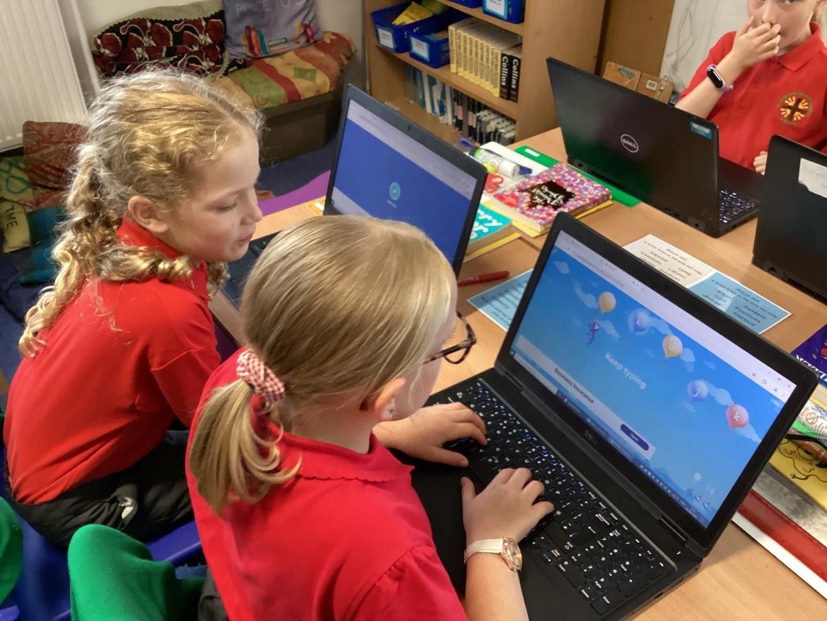 Children using laptops