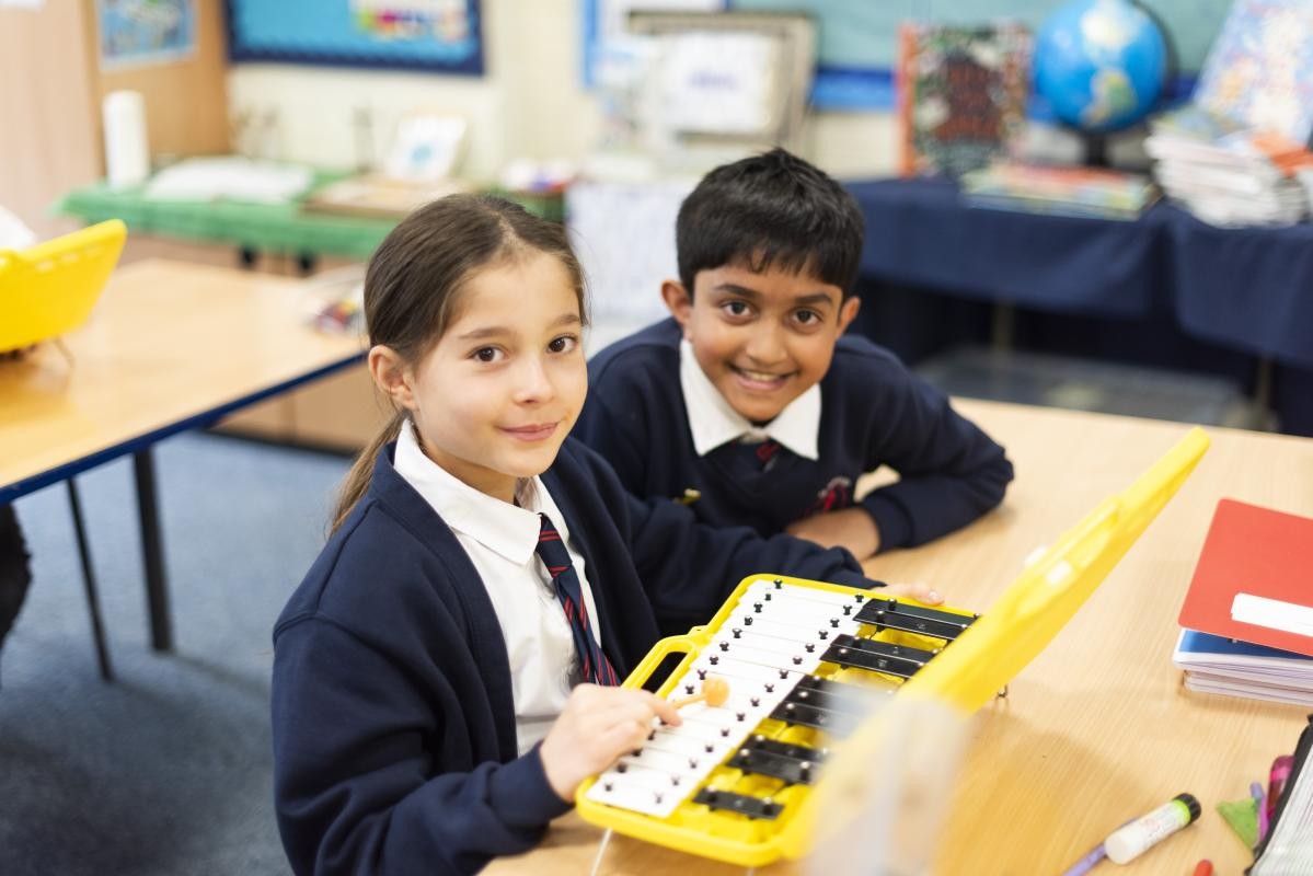 Children looking at a book together