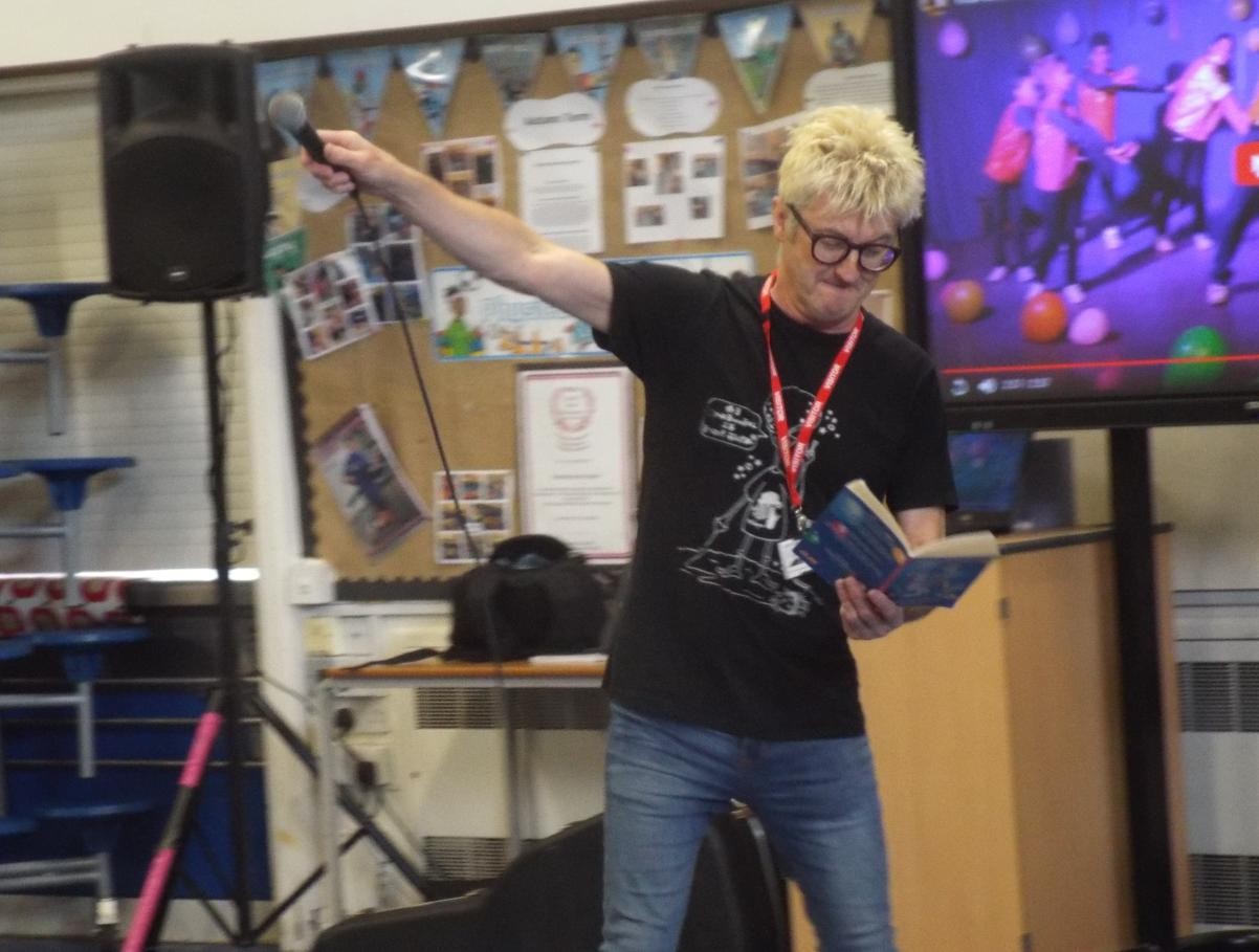 Spoz the Poet reading a poem about a pirate with the children's help.